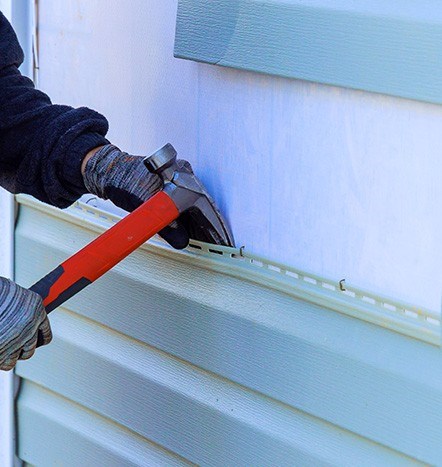 completing a siding repair in new jersey