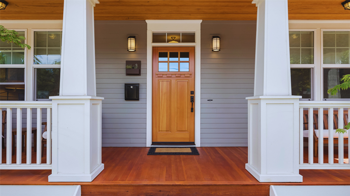 A new wood front door on a porch in NJ. 