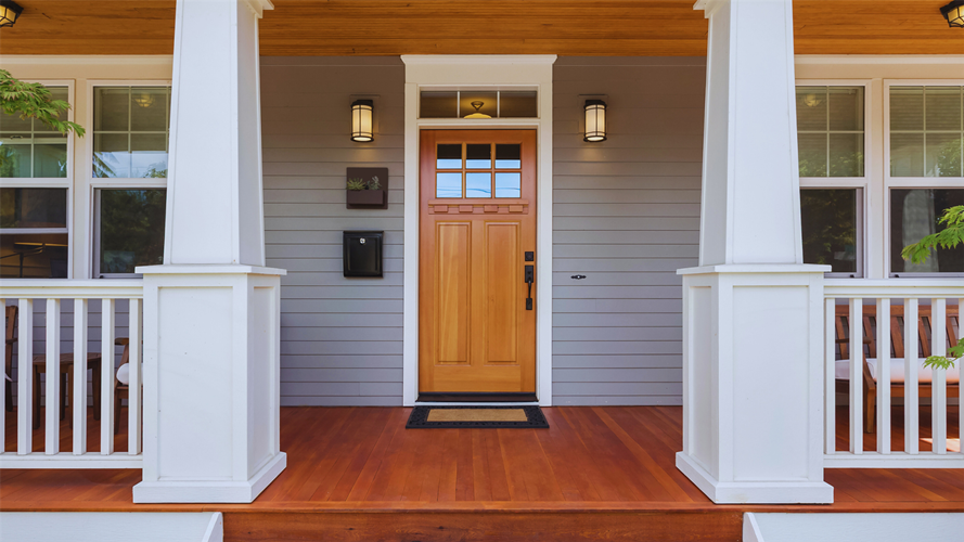 A new wood front door on a porch in NJ.