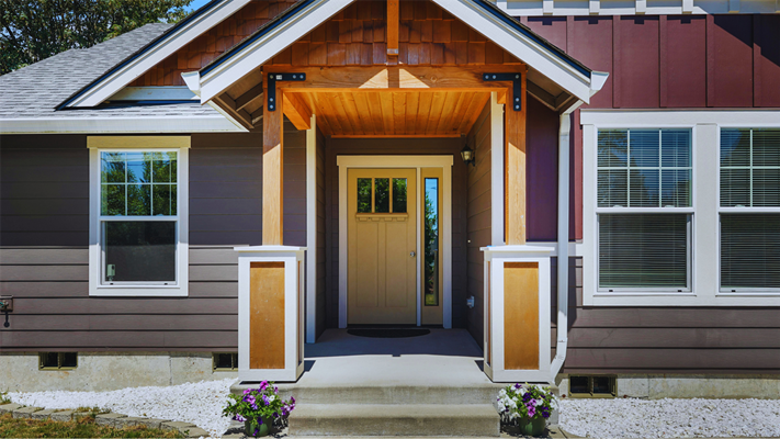 A NJ house with a new front door with a side transom.