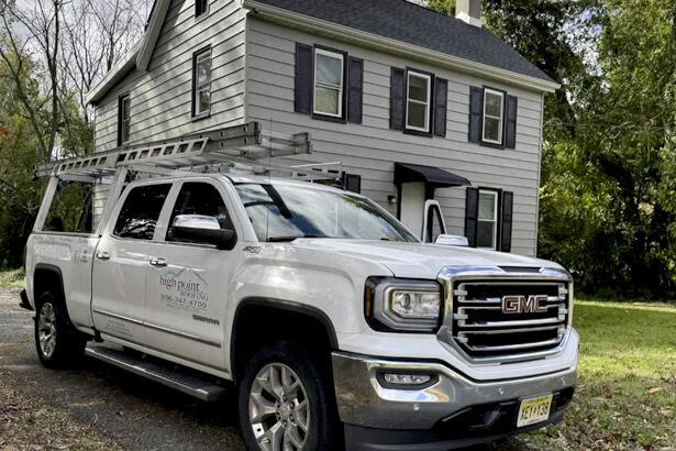 High Point Roofing working on a neighbors home in New Jersey