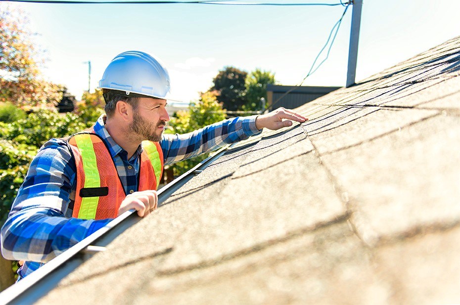 roofer inspecting a home roof in new jersey